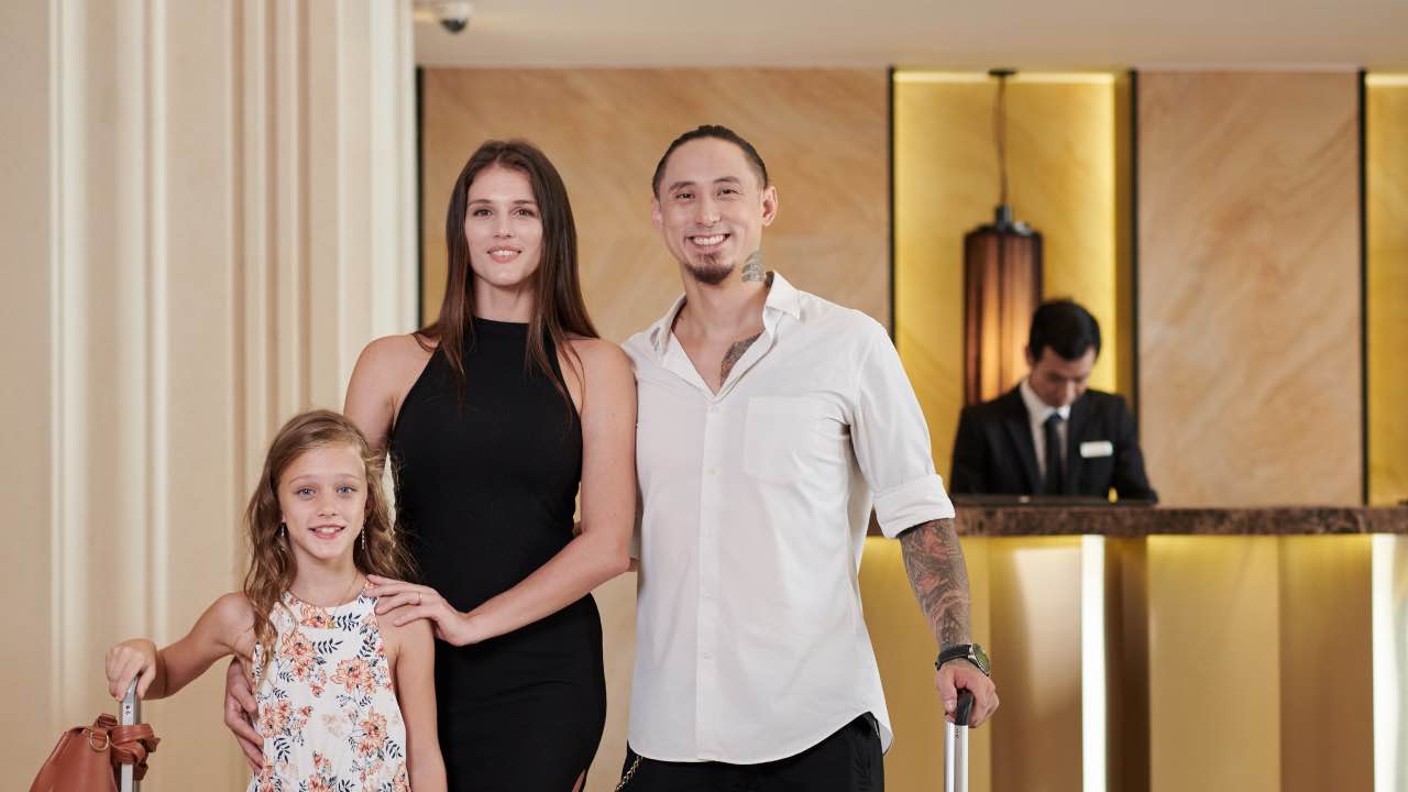 Family Standing in Hotel Hall