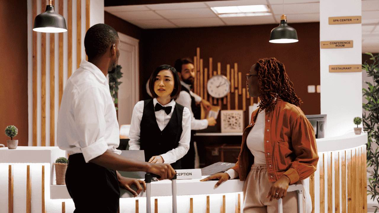 Hotel employee registering people